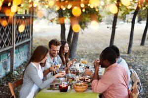 Group of friends eating outdoors