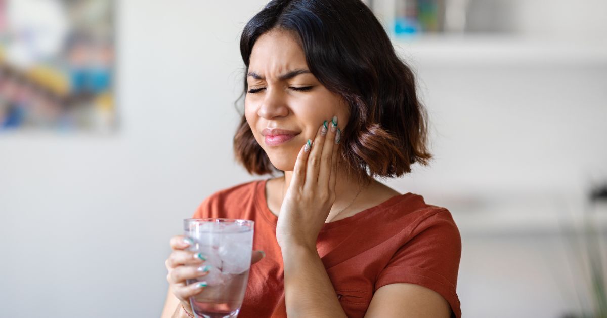 TMJ Jaw Pain Woman experiencing TMJ Jaw Pain in the morning