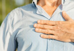 Man holding chest