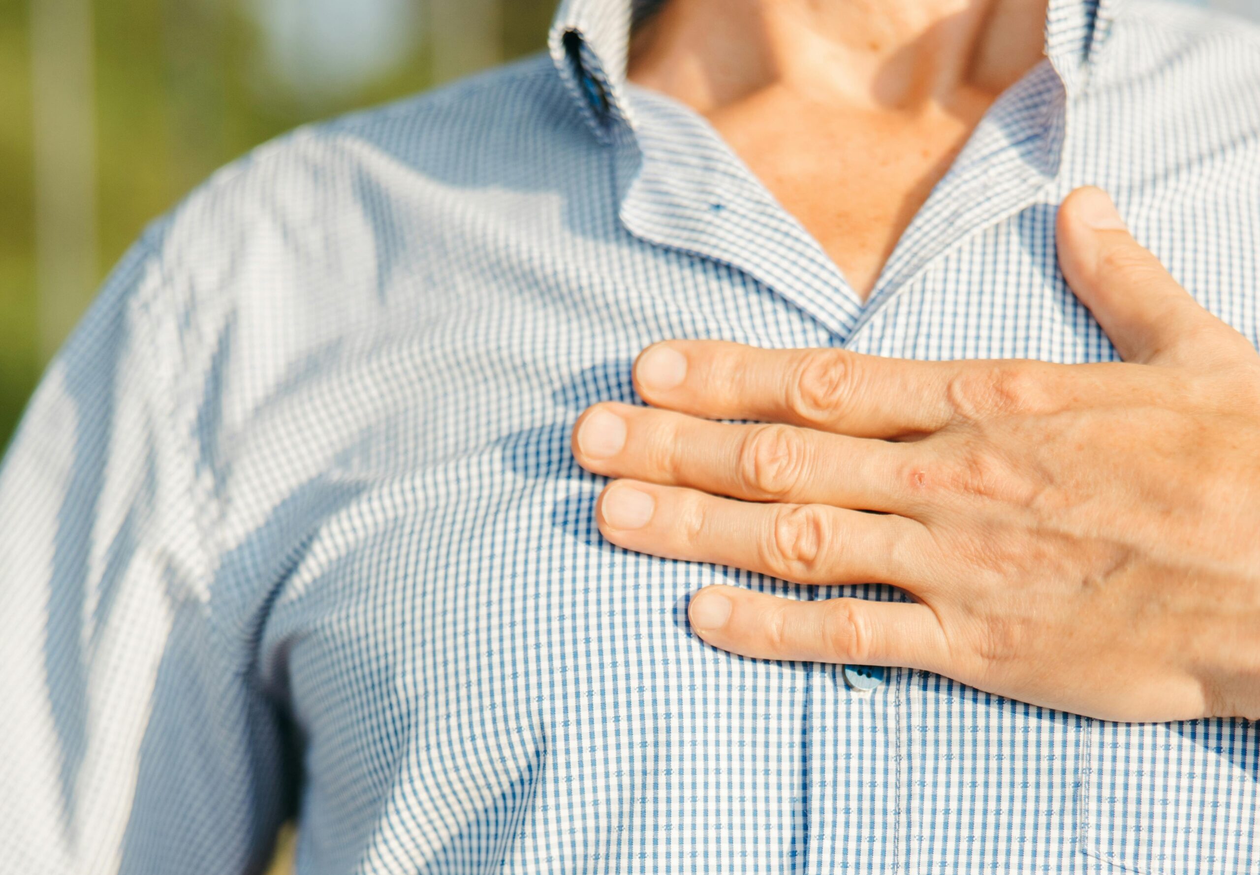 Man holding chest