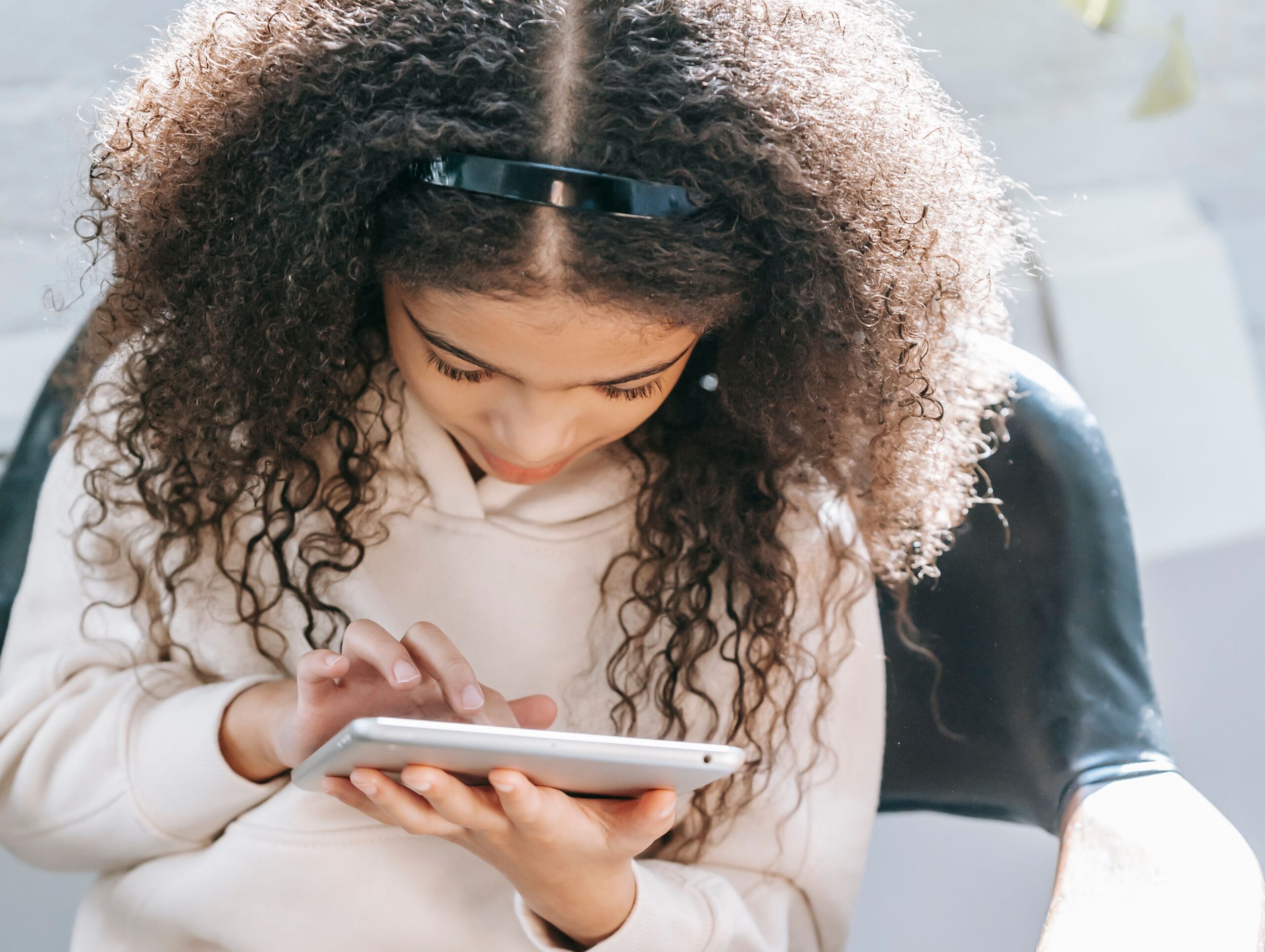 girl leaning forward watching screen